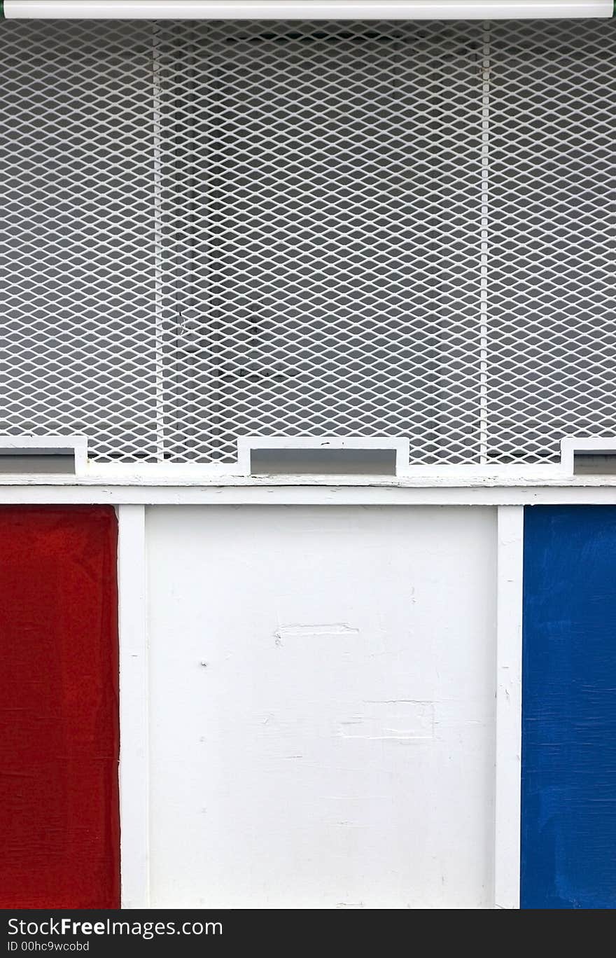 Old-fashioned carnival ticket booth with three windows in red, white, and blue. Old-fashioned carnival ticket booth with three windows in red, white, and blue