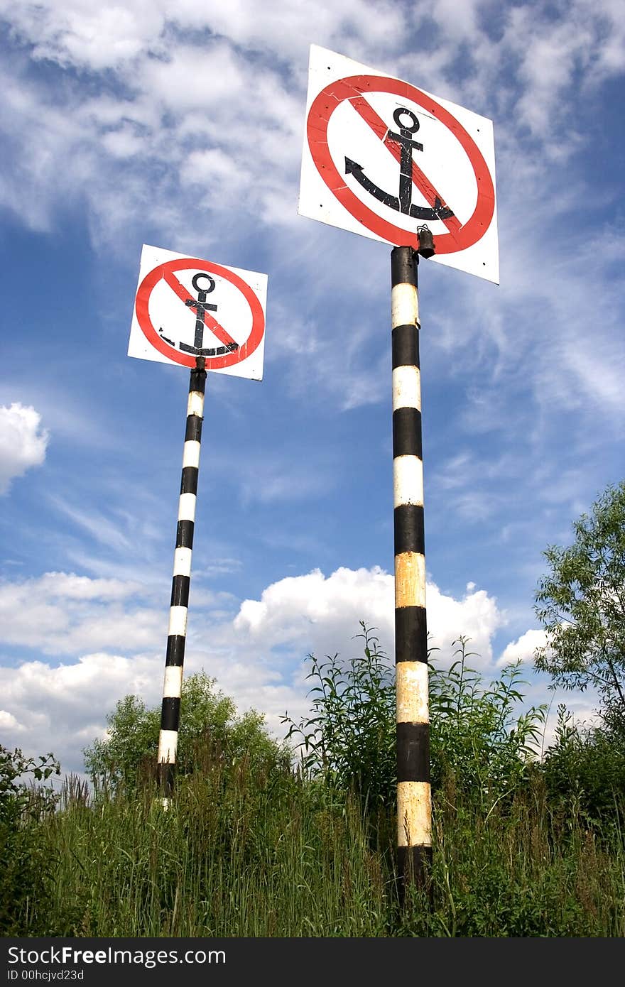 Two forbidden signs on blue sky. Two forbidden signs on blue sky.