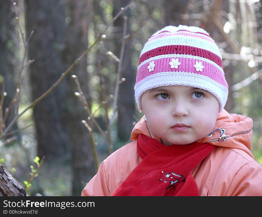 A little pretty girl in spring forest