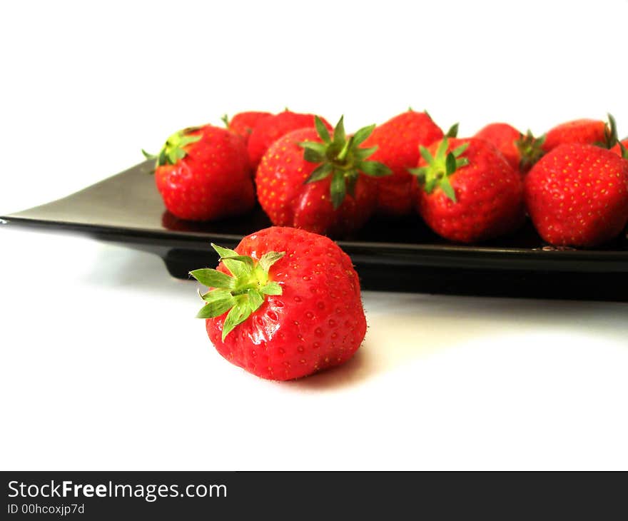 Strawberry in the dish isolated on white