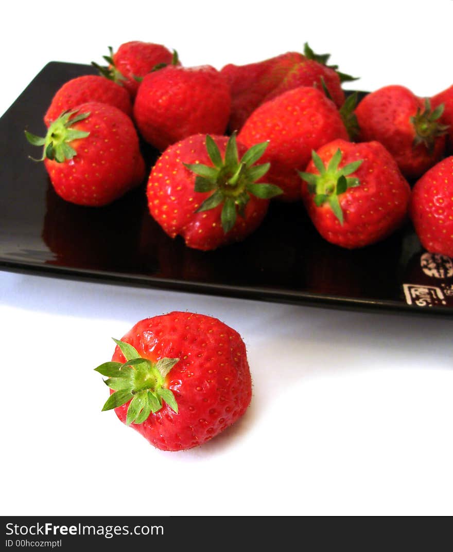 Strawberry in the dish isolated on white