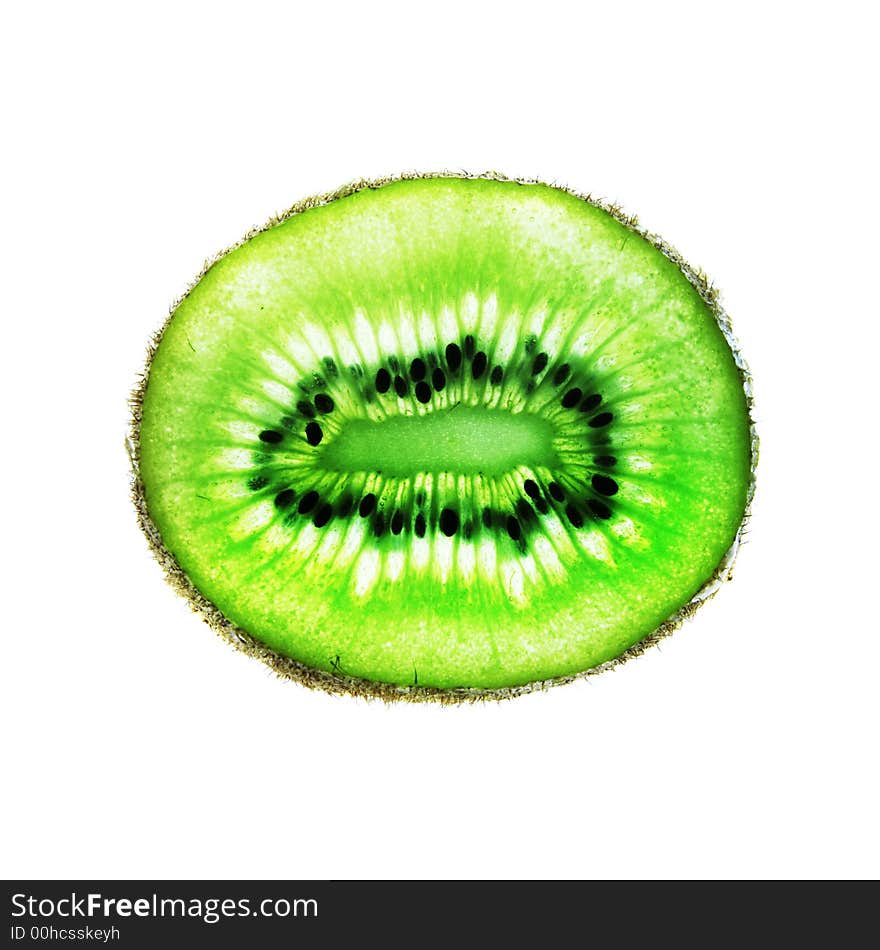 Back-lit kiwi fruit slice on a white background with clipping path. Back-lit kiwi fruit slice on a white background with clipping path