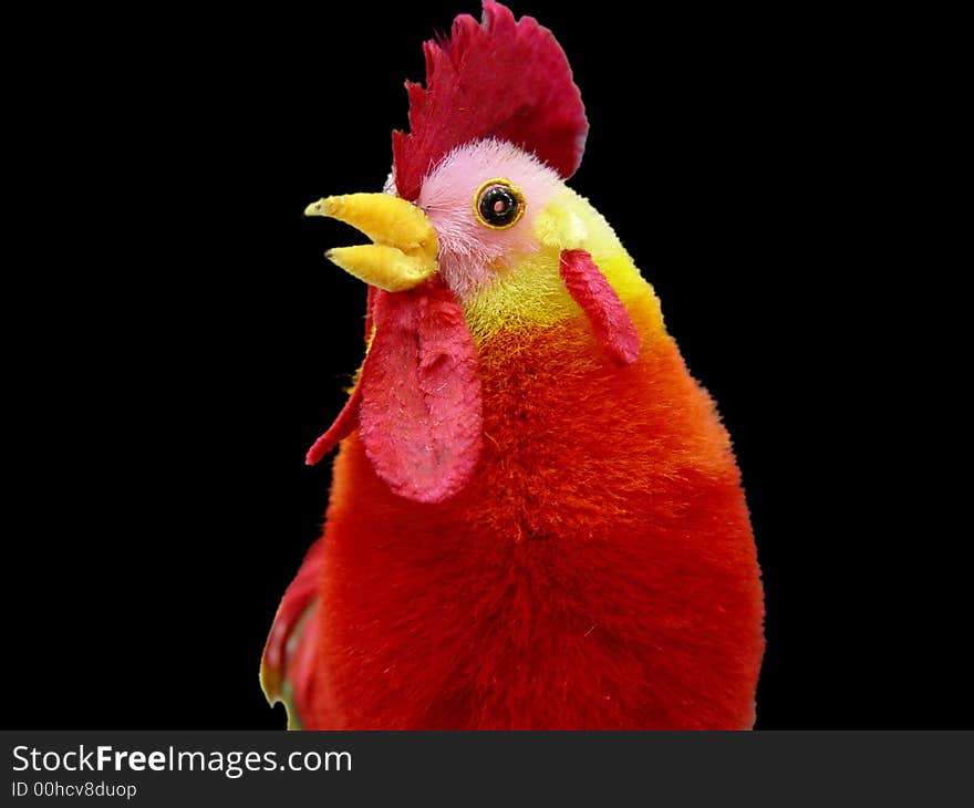 Beautiful toy rooster with colorful feathers