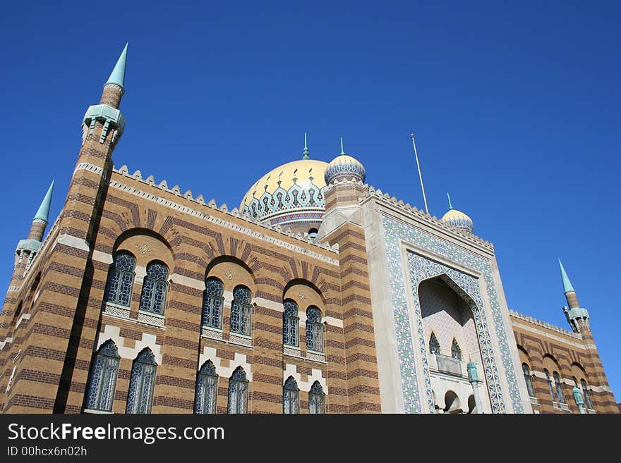 A beautifully tiled mosaic Church against blue skies