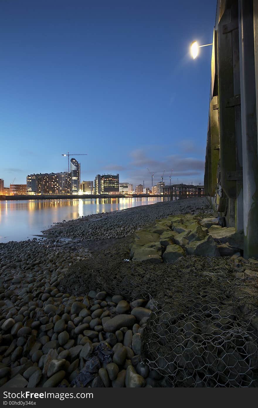 Thames riverbank at night showing the wharf