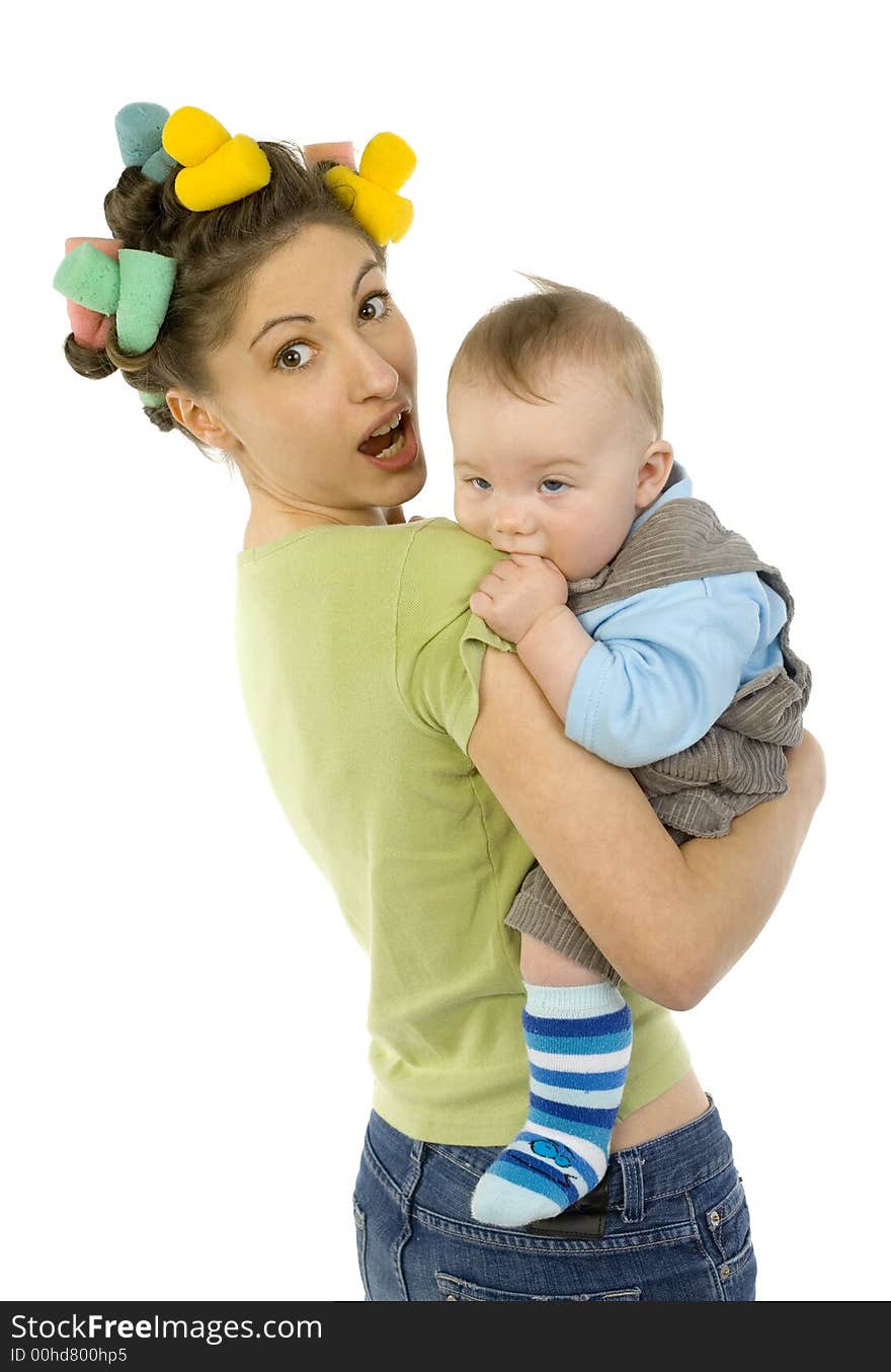 Young, beautiful woman with baby on hands. Baby is biting mother's arm. Mother is looking at camera. White background. Young, beautiful woman with baby on hands. Baby is biting mother's arm. Mother is looking at camera. White background