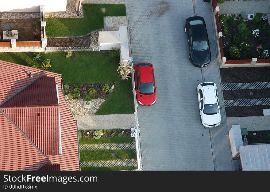 Air view of a street with cars and driveways. Air view of a street with cars and driveways