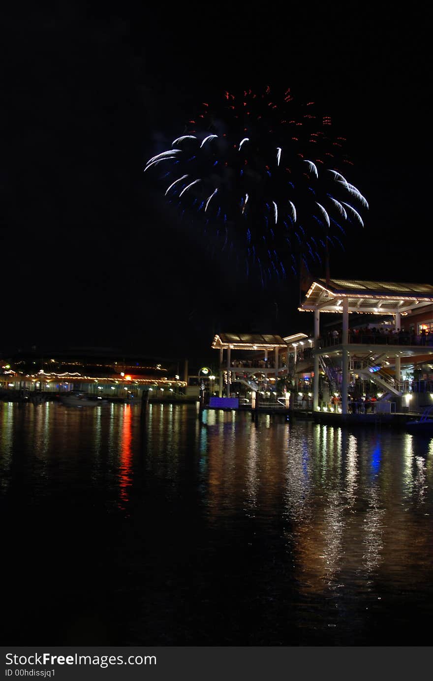 Red white and blue fireworks over water in Miami. Red white and blue fireworks over water in Miami