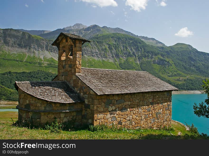 Old church at the edge of a lake in mountain. Old church at the edge of a lake in mountain