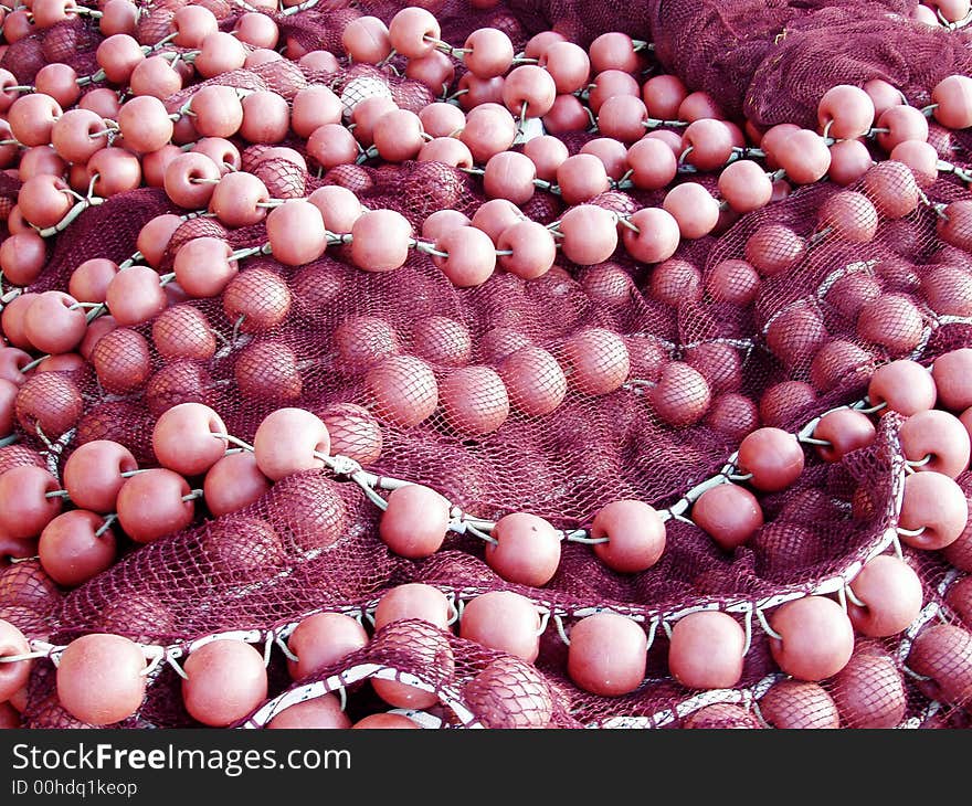 Red fishing nets and buoys