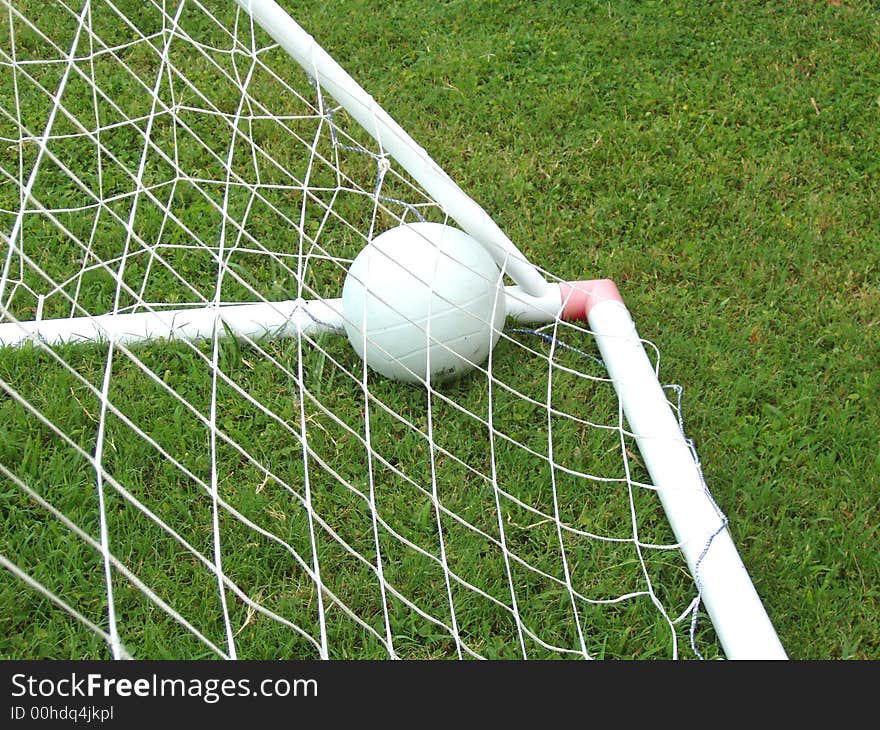 Soccer ball in a goalpost