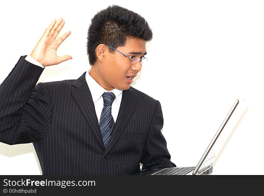 A young executive shocked when look at the result at the computer screen. A young executive shocked when look at the result at the computer screen.