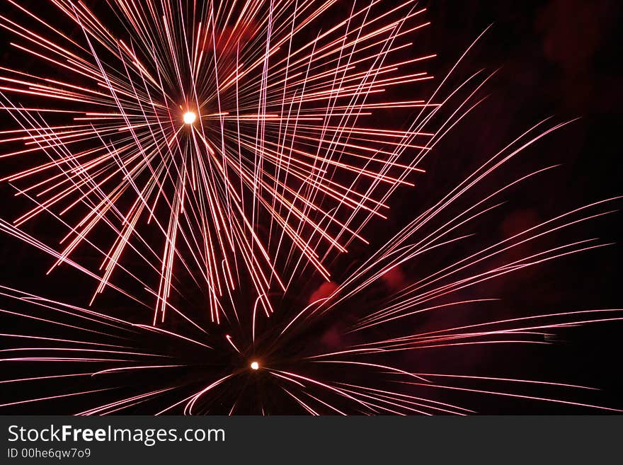 An image of exploding fireworks at night.