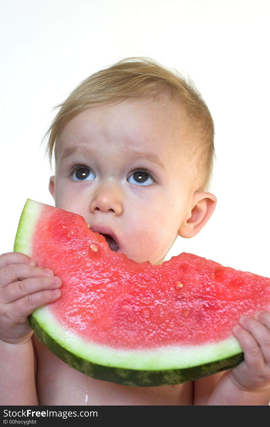 Image of cute toddler eating a big piece of watermelon. Image of cute toddler eating a big piece of watermelon