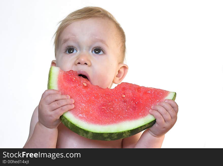 Image of cute toddler eating a big piece of watermelon. Image of cute toddler eating a big piece of watermelon