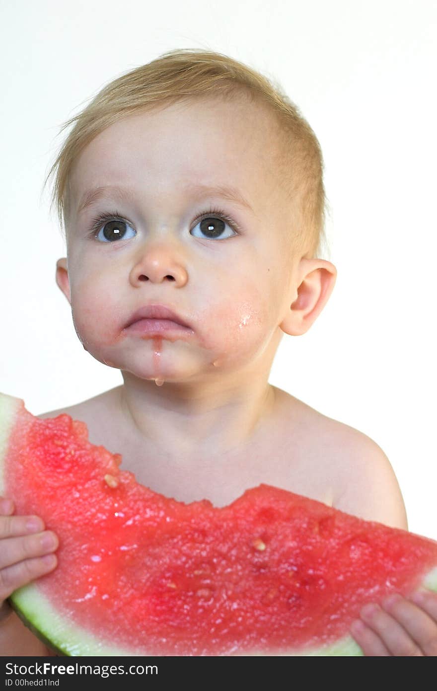 Image of cute toddler eating a big piece of watermelon. Image of cute toddler eating a big piece of watermelon