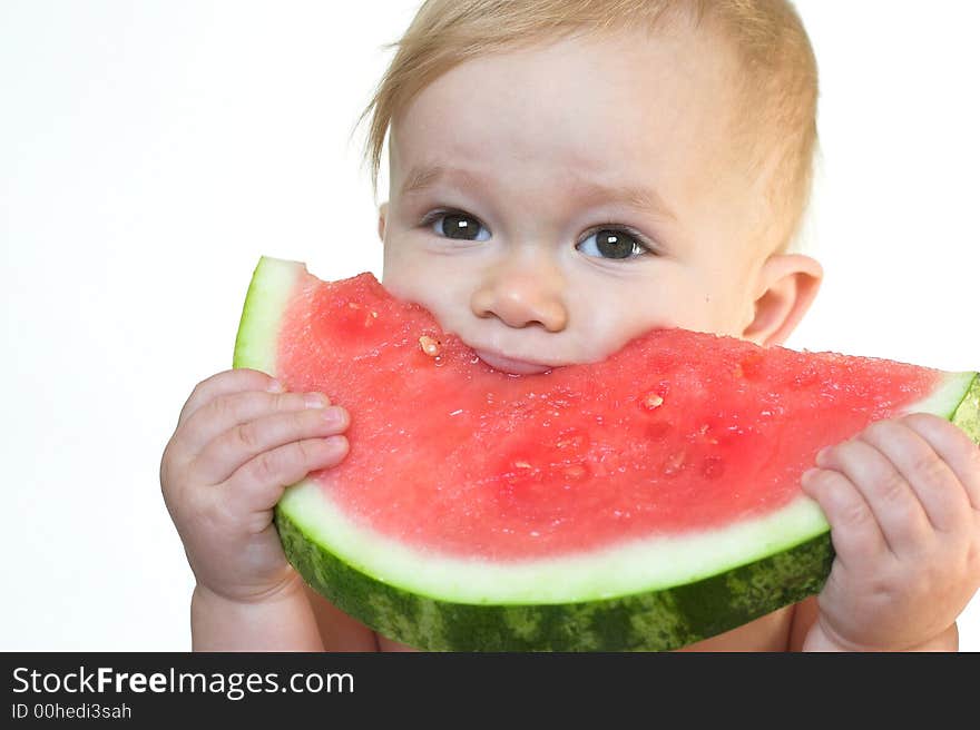 Image of cute toddler eating a big piece of watermelon. Image of cute toddler eating a big piece of watermelon