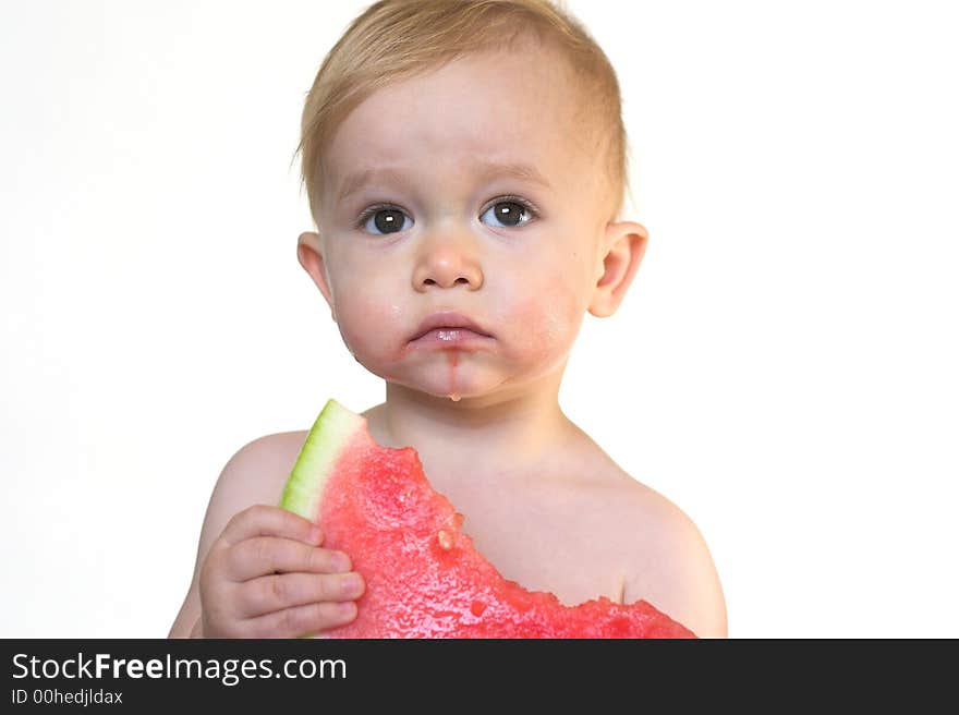 Image of cute toddler eating a big piece of watermelon. Image of cute toddler eating a big piece of watermelon