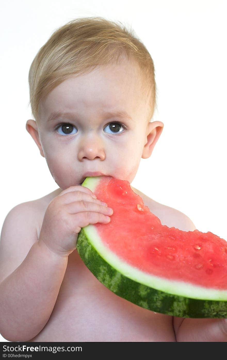 Image of cute toddler eating a big piece of watermelon. Image of cute toddler eating a big piece of watermelon