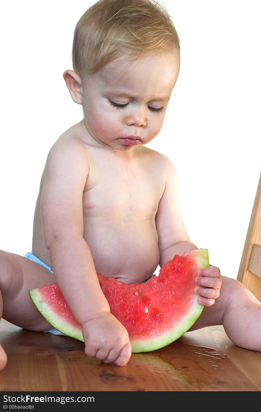 Image of cute toddler eating a big piece of watermelon. Image of cute toddler eating a big piece of watermelon