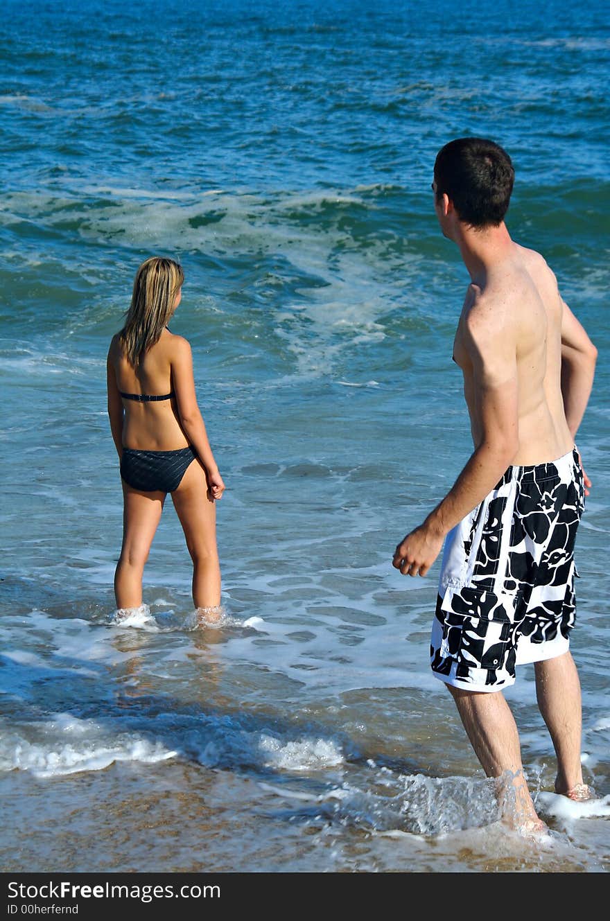 Teenage couple at the beach. Teenage couple at the beach.