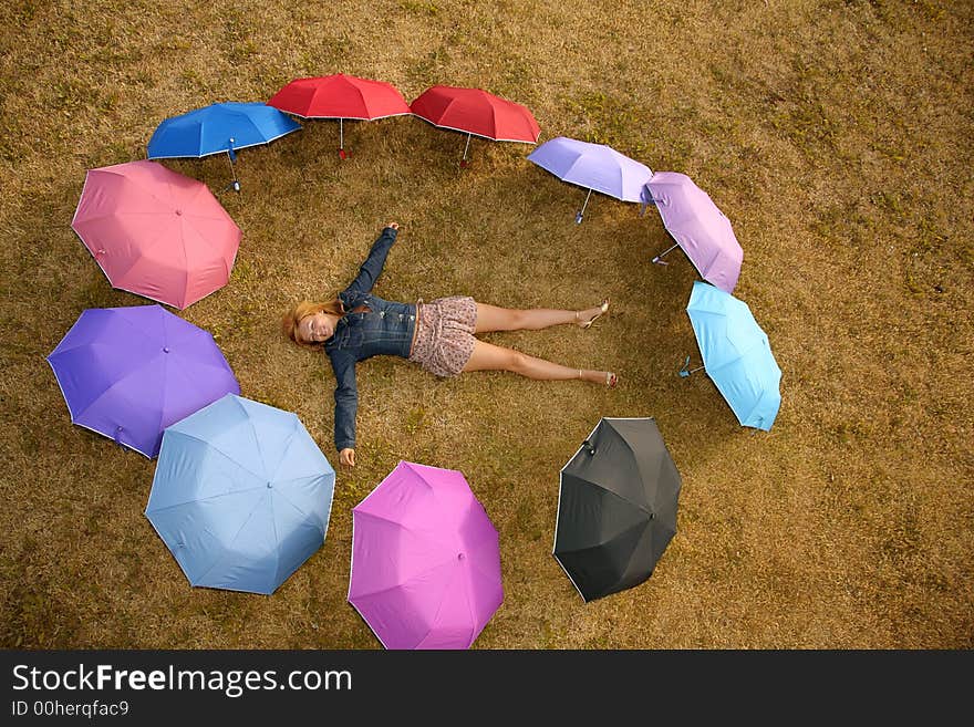 Woman in the ring of umbrellas