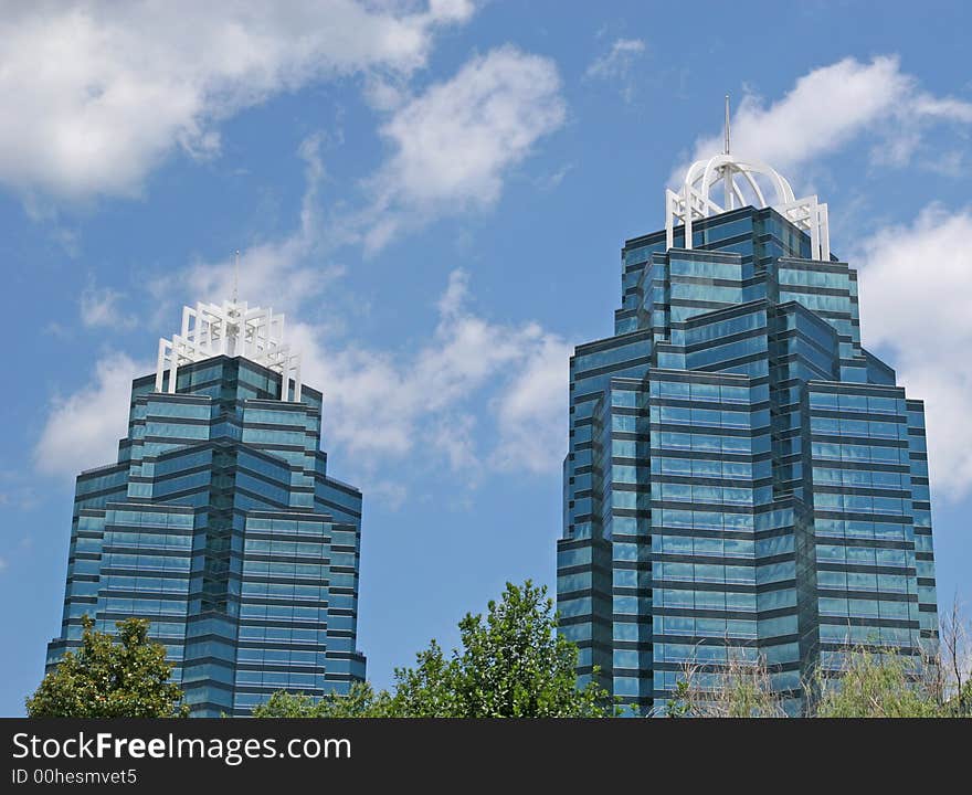 A pair of modern glass office towers. A pair of modern glass office towers