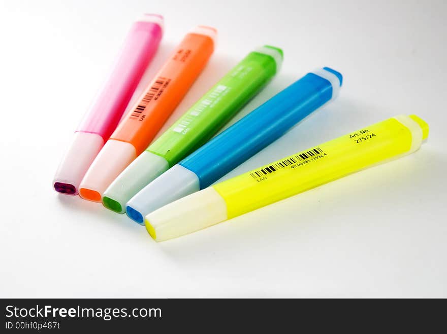 A variety of different bright coloured highlighter pens. Used oftenly in offices and school. A variety of different bright coloured highlighter pens. Used oftenly in offices and school