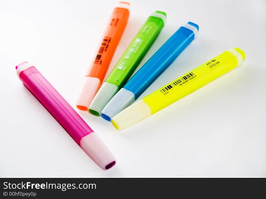 A variety of different bright coloured highlighter pens. Used oftenly in offices and school. A variety of different bright coloured highlighter pens. Used oftenly in offices and school