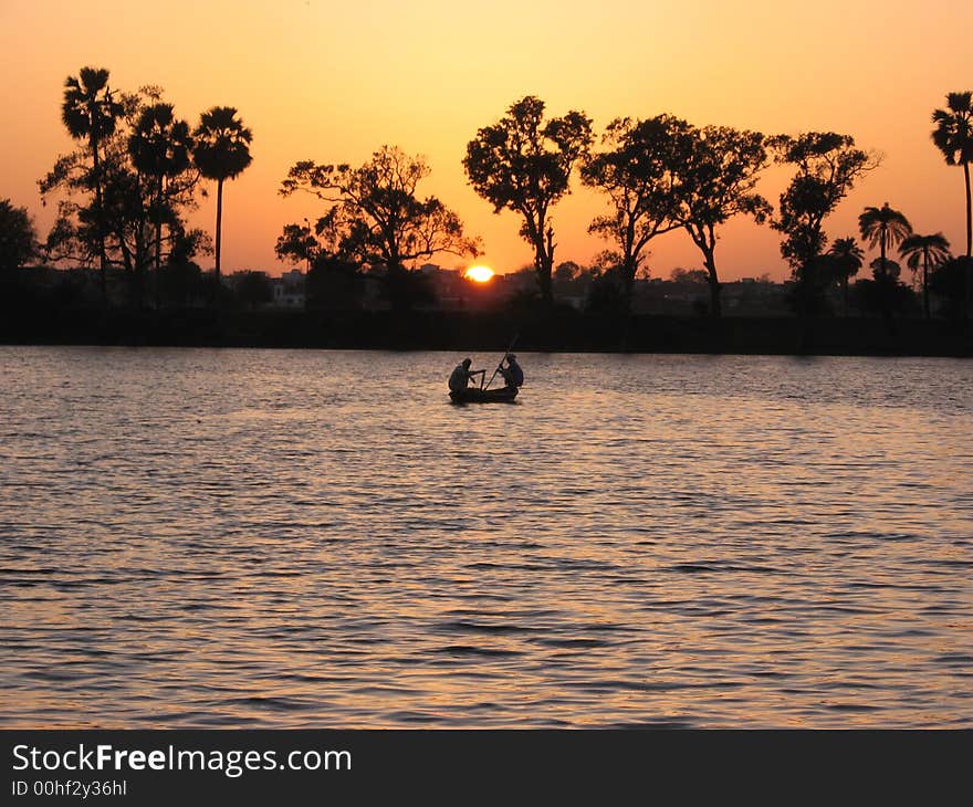 Fisherman are fishing just at the end of the day... Sun is almost set. Fisherman are fishing just at the end of the day... Sun is almost set