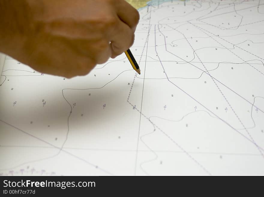 Details of nautical map whit a hand and  pencil