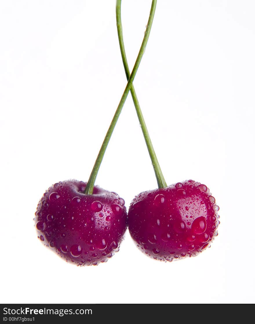 Cherry with water drops isolated on white