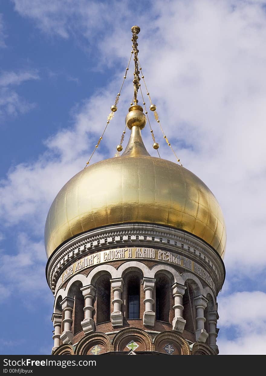 Golden tower top of a russian cathedral in St.Petersburg