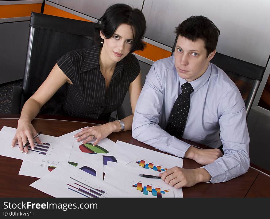 Business workgroup interacting in a boardroom setting. Business workgroup interacting in a boardroom setting