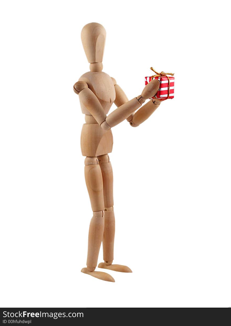 Wooden man presenting a wrapped christmas present. Isolated on white. Wooden man presenting a wrapped christmas present. Isolated on white