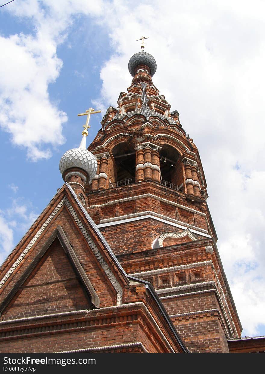 Age-old khrestian church with white domes and gold crosses