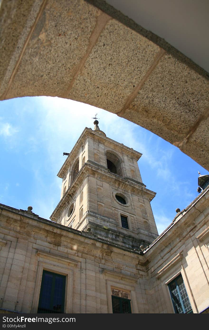 Tower seen from one of the many small yards of the Monastery of Escorial in Madrid built by Philippe II all in granite stone. Tower seen from one of the many small yards of the Monastery of Escorial in Madrid built by Philippe II all in granite stone