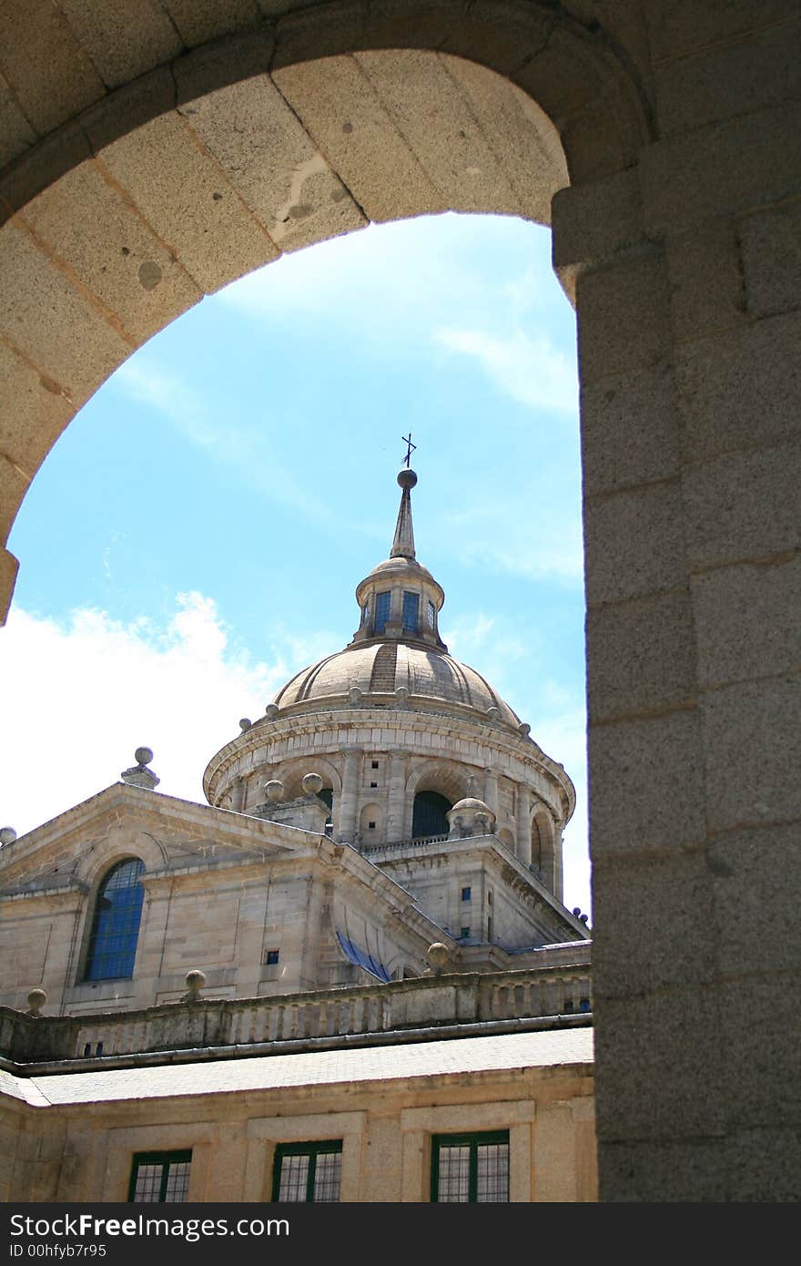 Dome of the granitic basilica of Escorial from one of its many yards. Dome of the granitic basilica of Escorial from one of its many yards