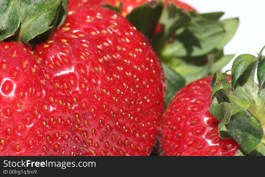 Juicy red strawberries isolated on white background