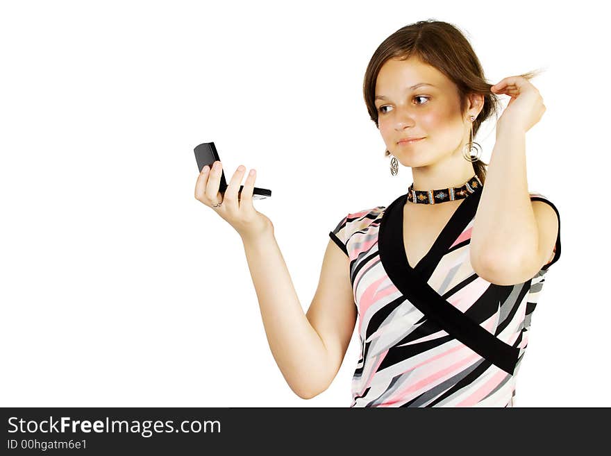 Young girl look in to mirror and combing. Isolate on white.