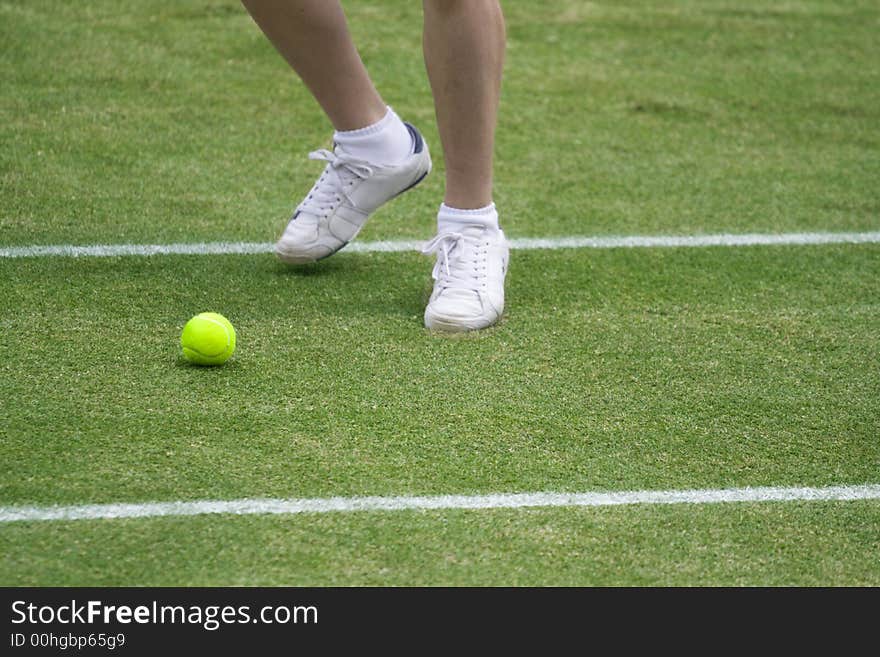 A ball boy chases a ball during the Wimbledon Championships in london 2007 after the ball has hit the net. A ball boy chases a ball during the Wimbledon Championships in london 2007 after the ball has hit the net.