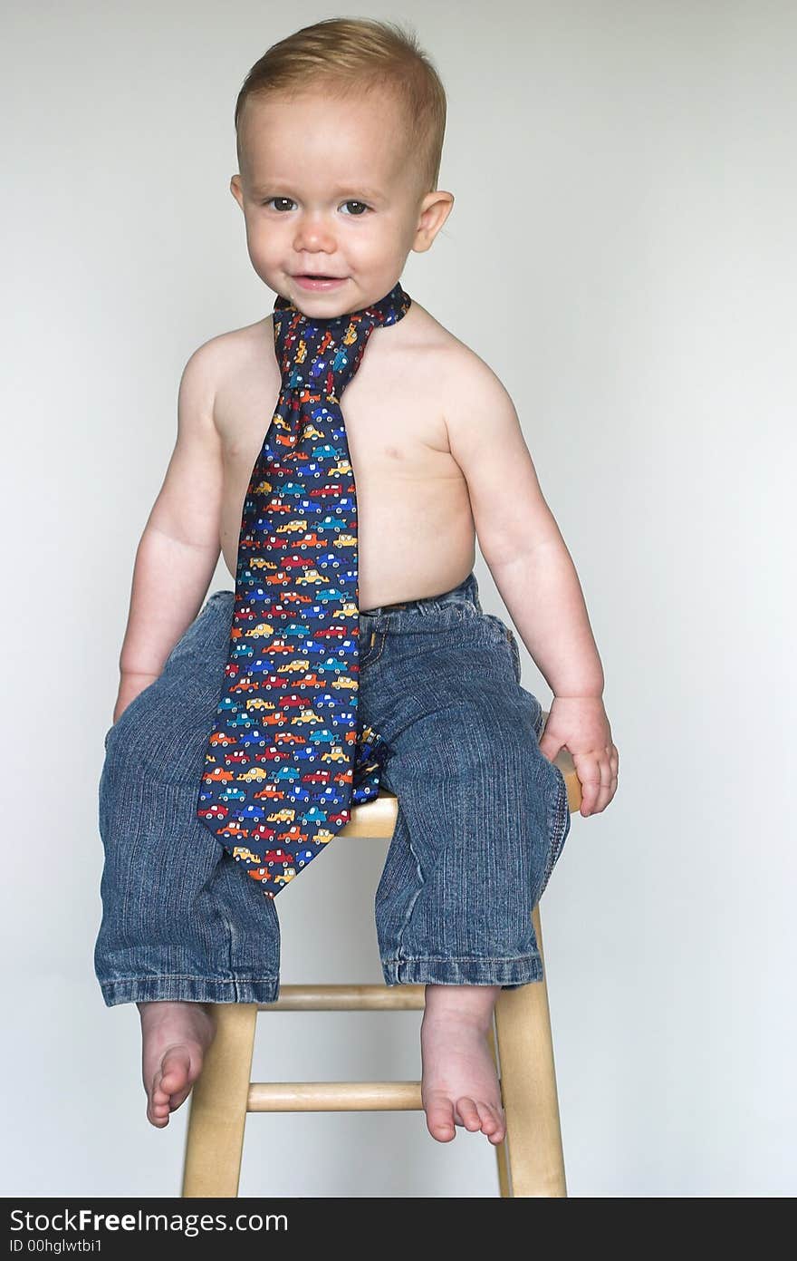 Image of cute toddler wearing jeans and a tie. Image of cute toddler wearing jeans and a tie