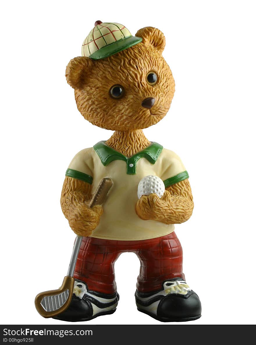 This is a toy bear with a golf club and a golf ball ready to tee off. This is a toy bear with a golf club and a golf ball ready to tee off