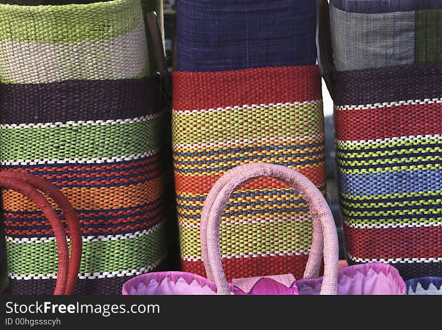 At a market in Paris woven handbags for sale