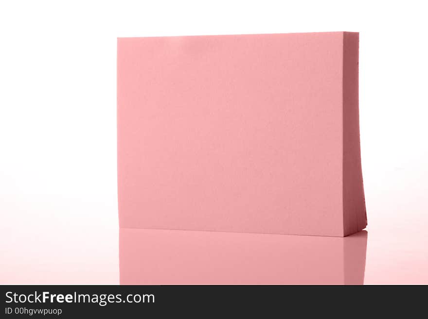 Pink paper with reflection on white