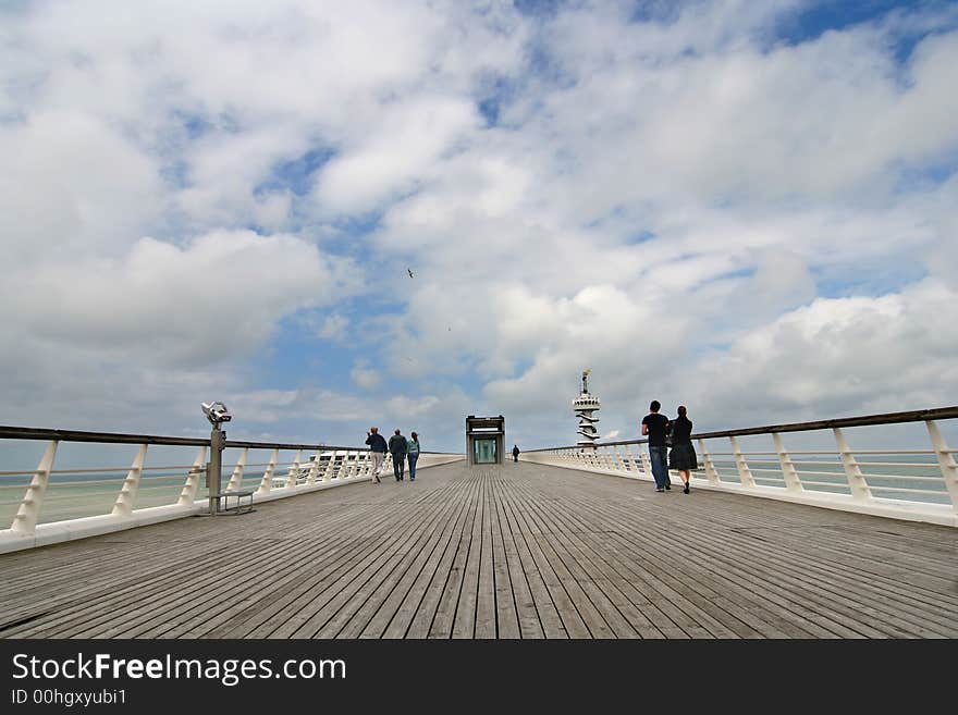 People walking on a pier