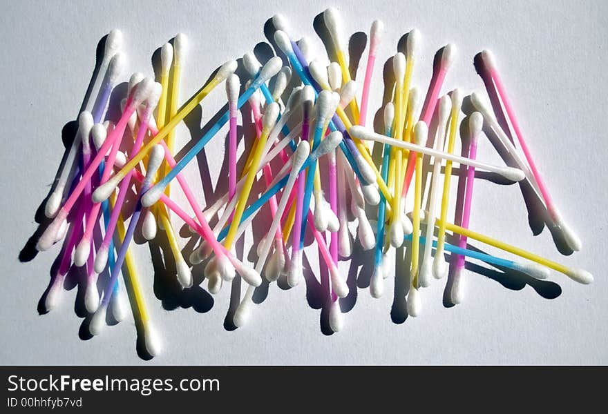 Colored cotton tip buds randomly arranged. Colored cotton tip buds randomly arranged