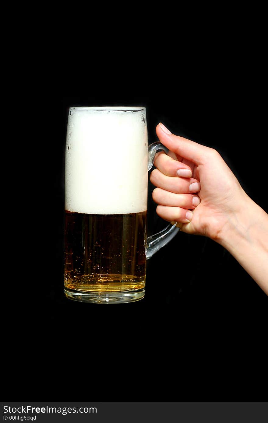 Beer in woman hand with black background