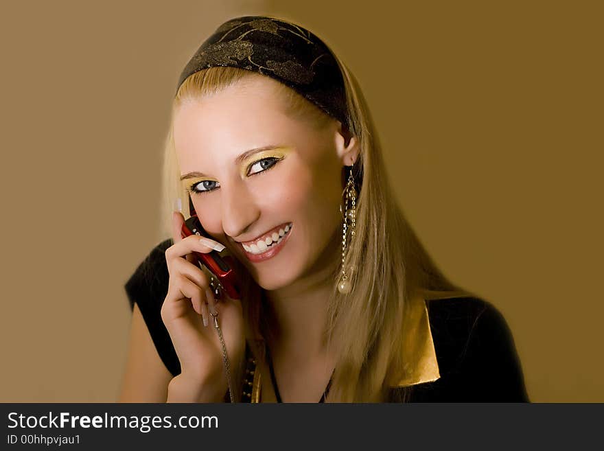 Young beautiful  blond girl with mobile phone