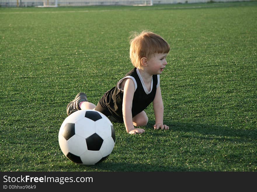 The young football player cries after falling